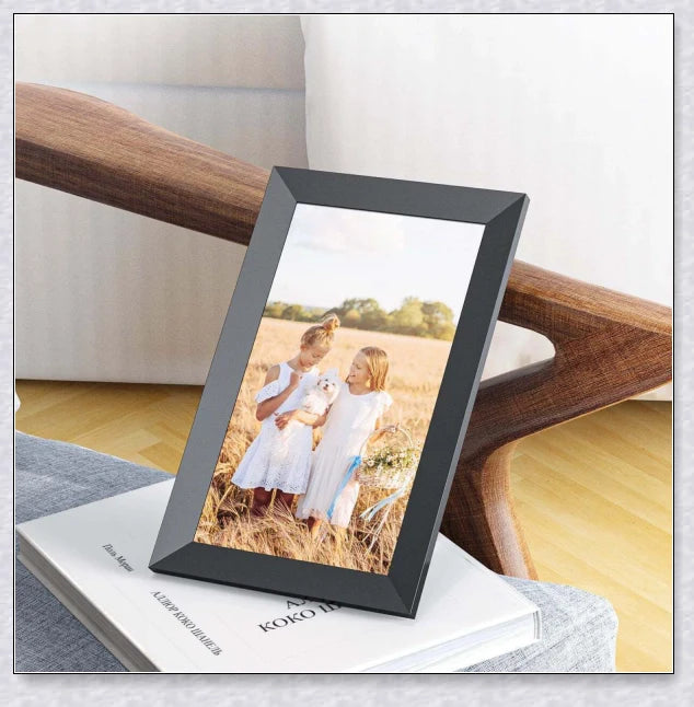 Smart Electronic WiFi Digital Photo and Video Picture Frame in black, displaying a slideshow of family photos and videos on a 10.1-inch HD IPS display