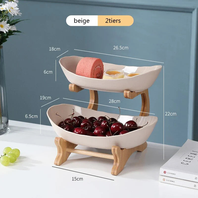 Partitioned oval table plates and fruit bowl with tiered candy and cake trays in beige