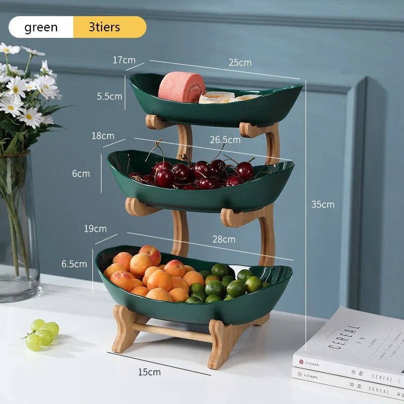 Partitioned oval table plates and fruit bowl with tiered candy and cake trays in beige