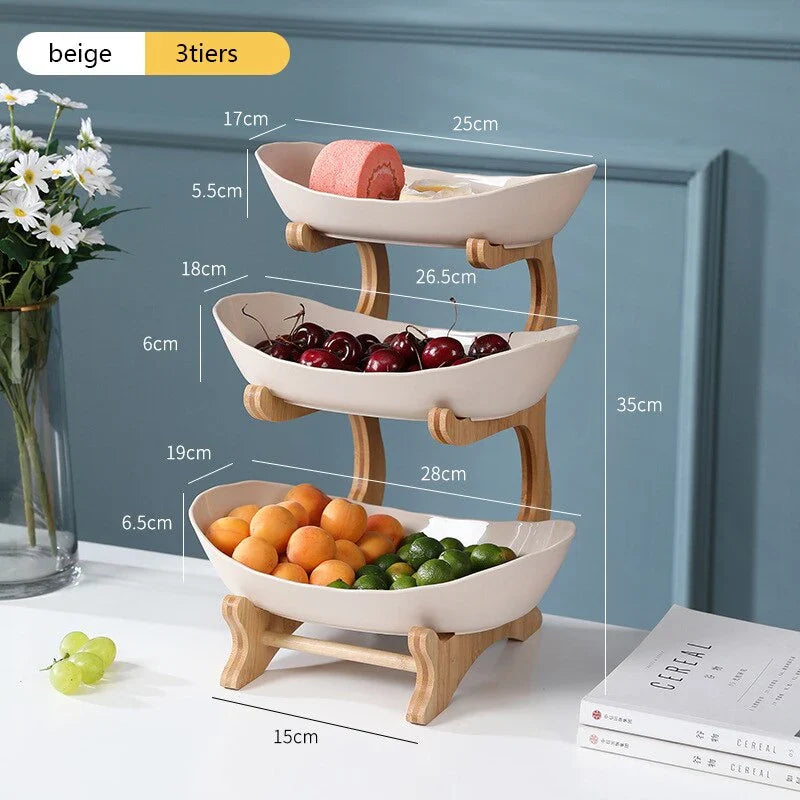 Partitioned oval table plates and fruit bowl with tiered candy and cake trays in beige