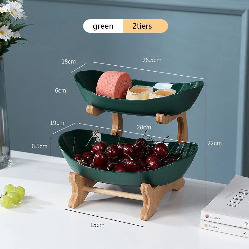 Partitioned oval table plates and fruit bowl with tiered candy and cake trays in beige