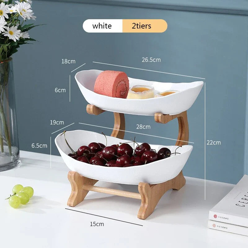 Partitioned oval table plates and fruit bowl with tiered candy and cake trays in beige