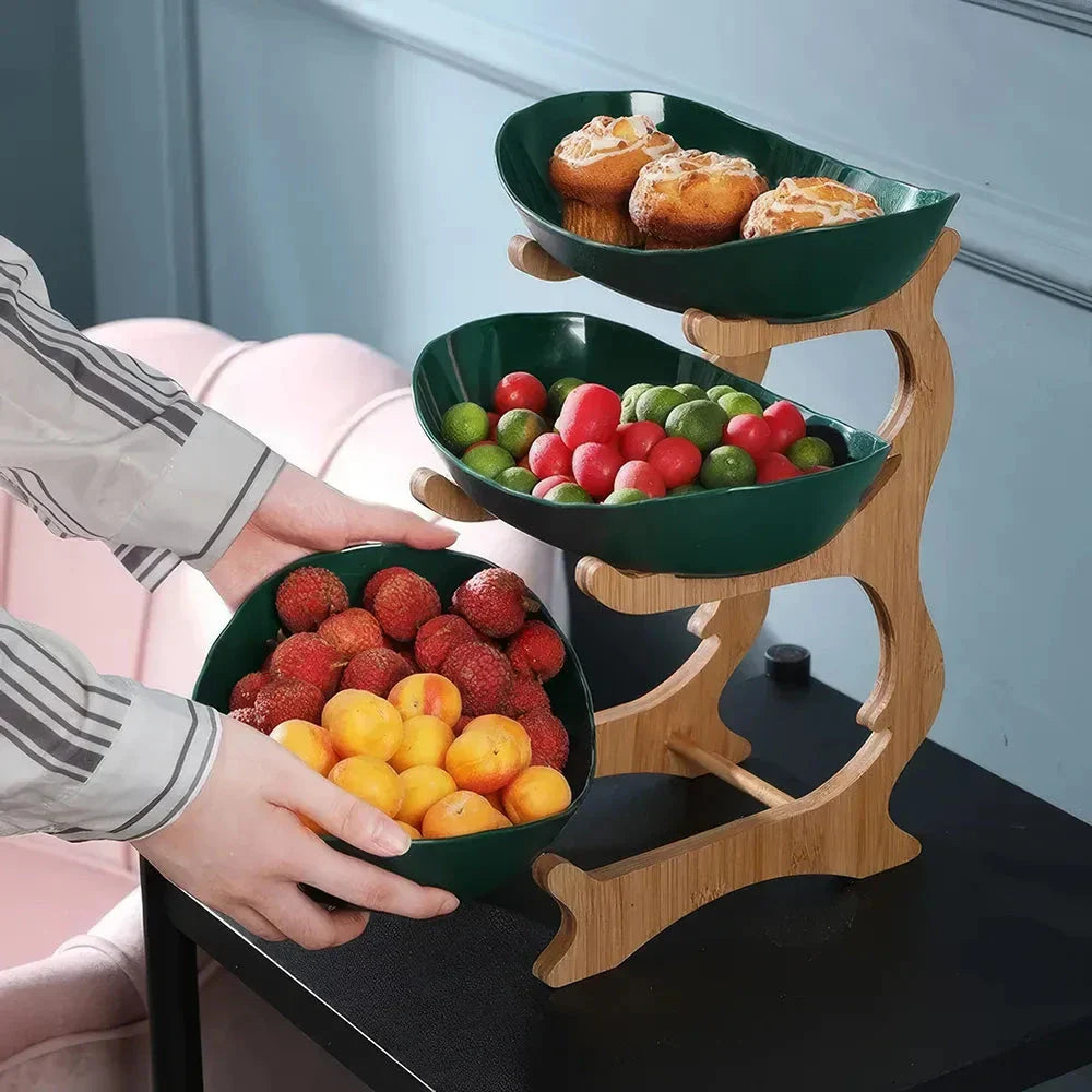 Partitioned oval table plates and fruit bowl with tiered candy and cake trays in beige