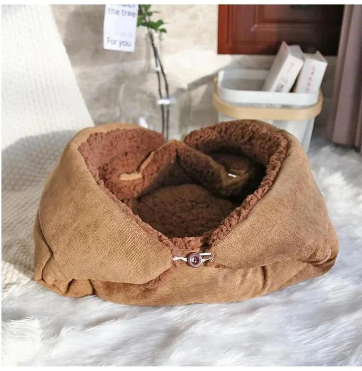 Cosy winter cat bed in plush brown fabric with a charming cartoon design, providing a warm and comfortable retreat for feline companions.