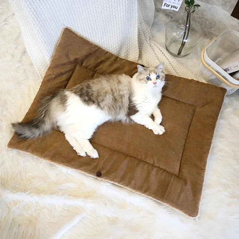 Cosy winter cat bed in plush brown fabric with a charming cartoon design, providing a warm and comfortable retreat for feline companions.