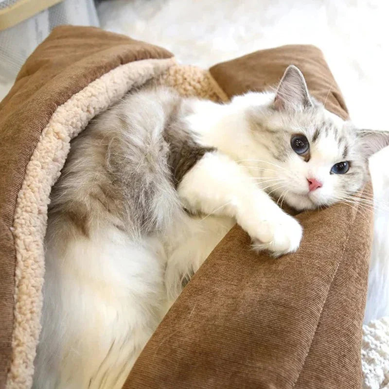 Cosy winter cat bed in plush brown fabric with a charming cartoon design, providing a warm and comfortable retreat for feline companions.