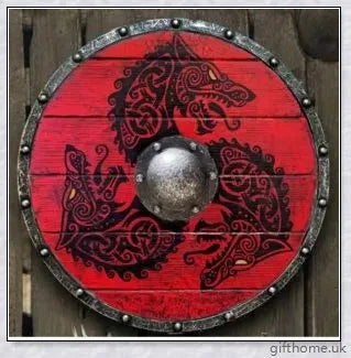 Authentic battle-worn Viking shield with two ravens design and iron spikes, adorned with Celtic buckle and rune characters