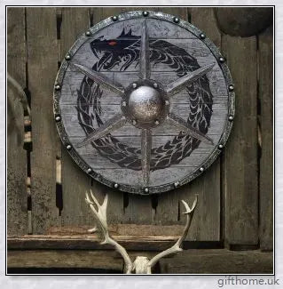 Authentic battle-worn Viking shield with two ravens design and iron spikes, adorned with Celtic buckle and rune characters