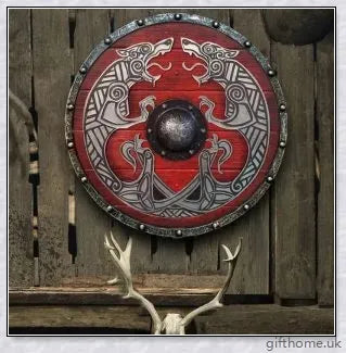 Authentic battle-worn Viking shield with two ravens design and iron spikes, adorned with Celtic buckle and rune characters