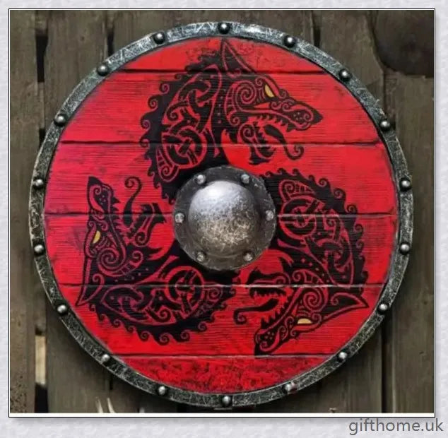 Authentic battle-worn Viking shield with two ravens design and iron spikes, adorned with Celtic buckle and rune characters