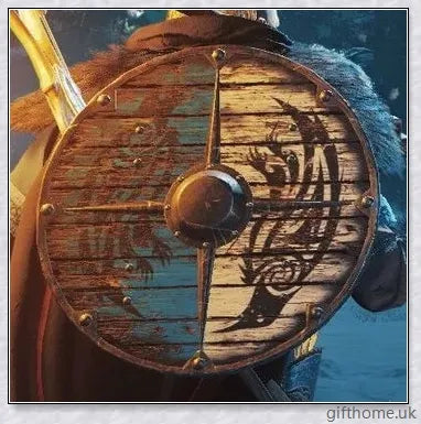 Authentic battle-worn Viking shield with two ravens design and iron spikes, adorned with Celtic buckle and rune characters