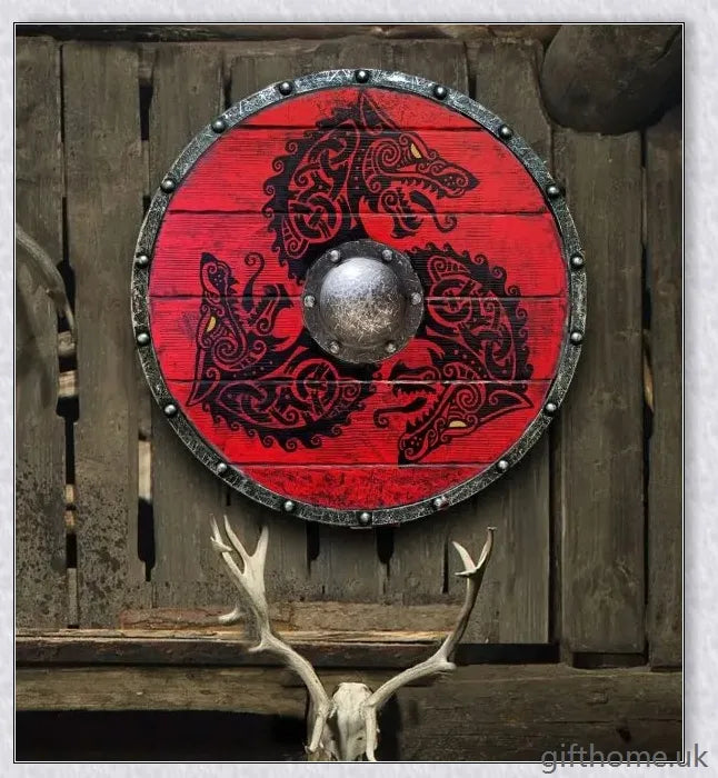 Authentic battle-worn Viking shield with two ravens design and iron spikes, adorned with Celtic buckle and rune characters