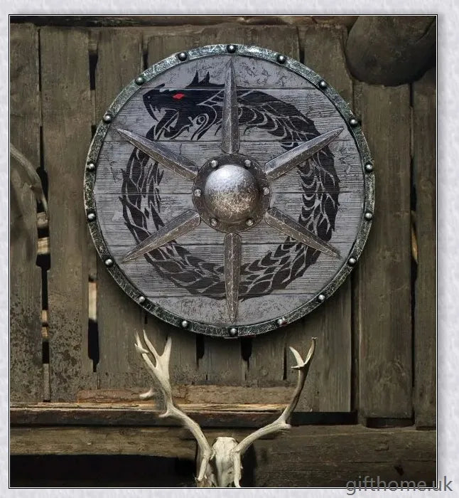 Authentic battle-worn Viking shield with two ravens design and iron spikes, adorned with Celtic buckle and rune characters
