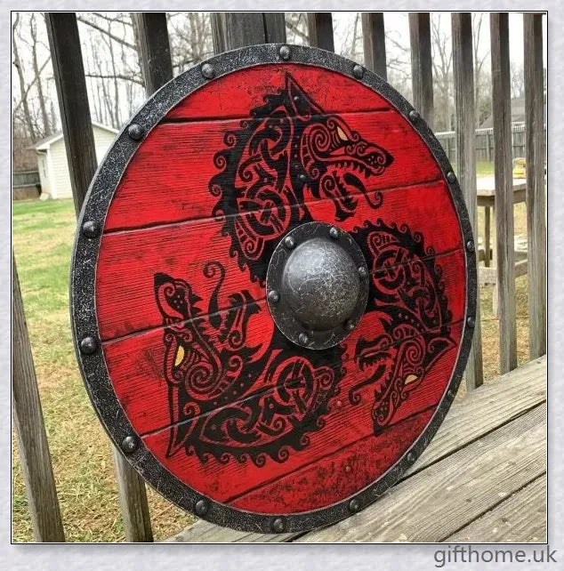 Authentic battle-worn Viking shield with two ravens design and iron spikes, adorned with Celtic buckle and rune characters