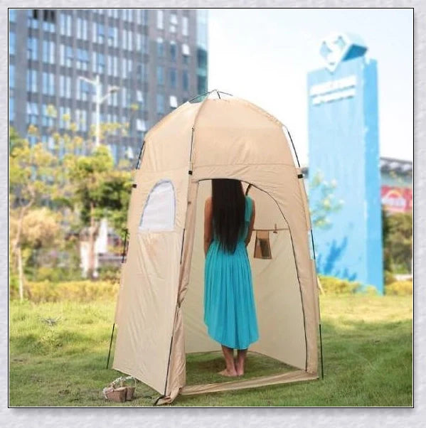 Portable camping shower tent in green, blue, and grey colours, providing instant privacy for outdoor activities