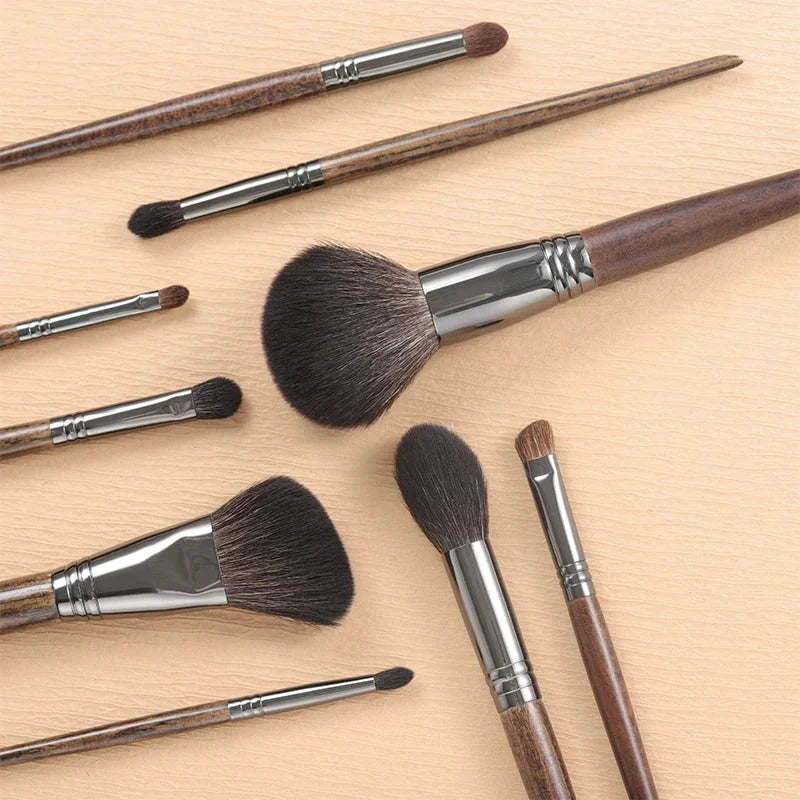 A set of 9 premium makeup brushes with soft goat hair bristles and natural wood handles, designed for flawless makeup application.