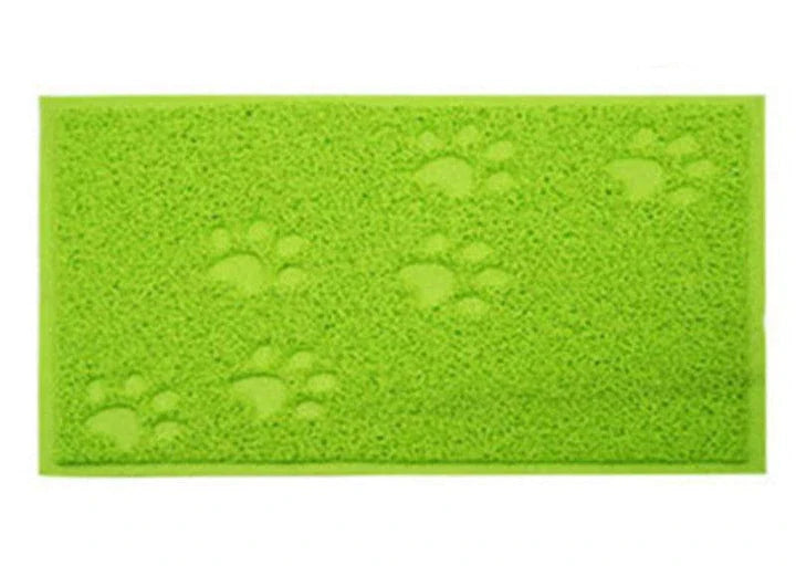 Colourful pet feeding mat made of durable PVC material, with a vibrant green design and slip-resistant surface to keep bowls in place during mealtimes.