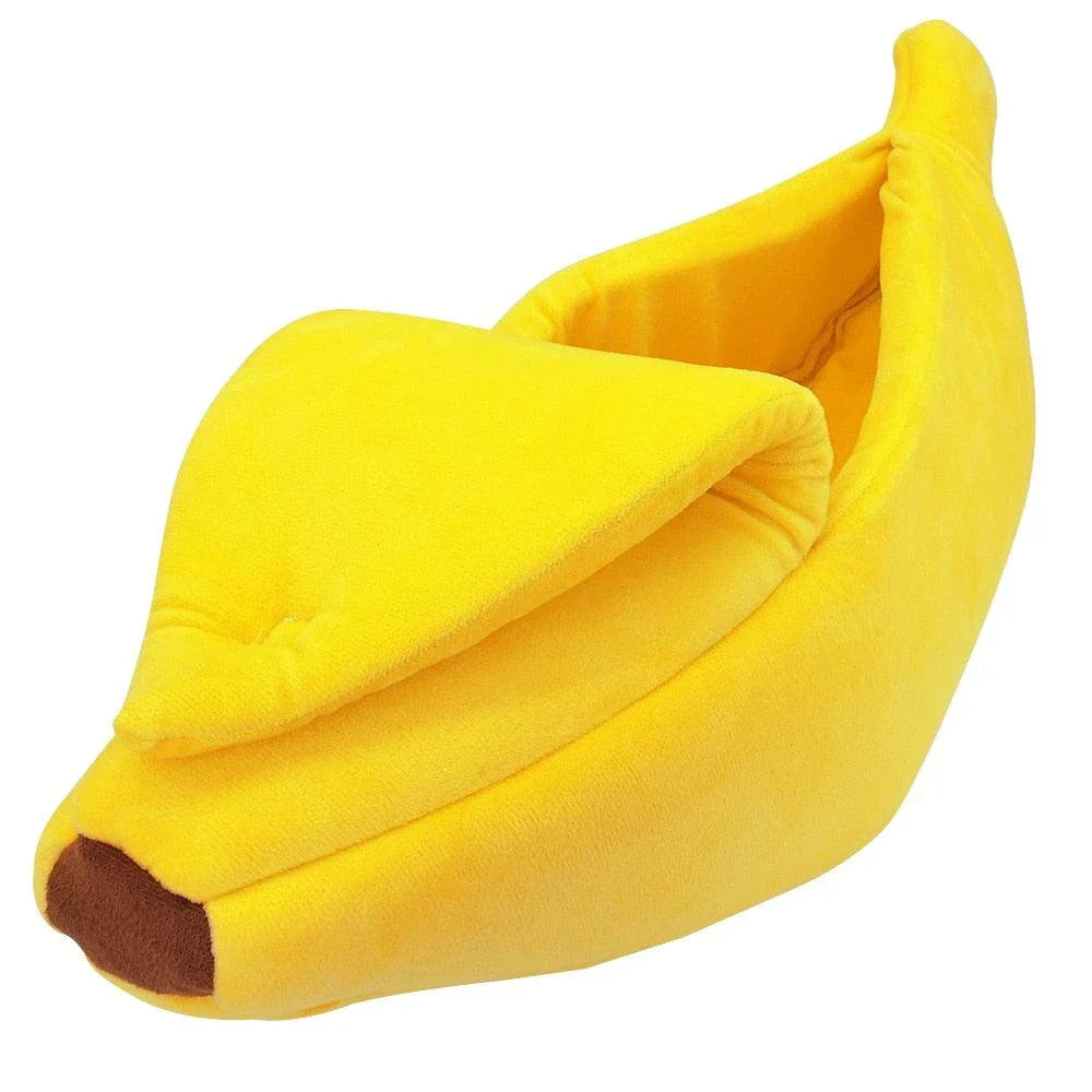 Cosy banana-shaped bed for cats in bright yellow colour, providing a comfortable and stylish resting spot for felines.