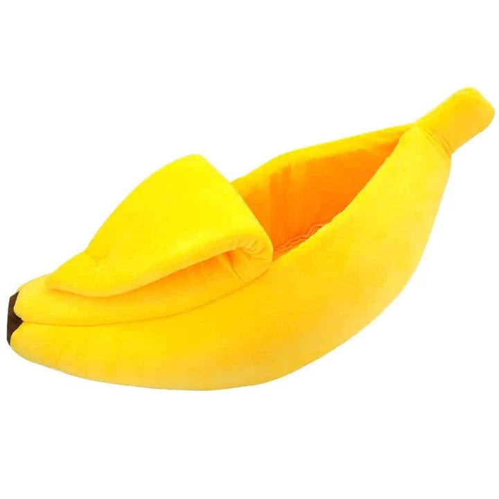 Cosy banana-shaped bed for cats in bright yellow colour, providing a comfortable and stylish resting spot for felines.