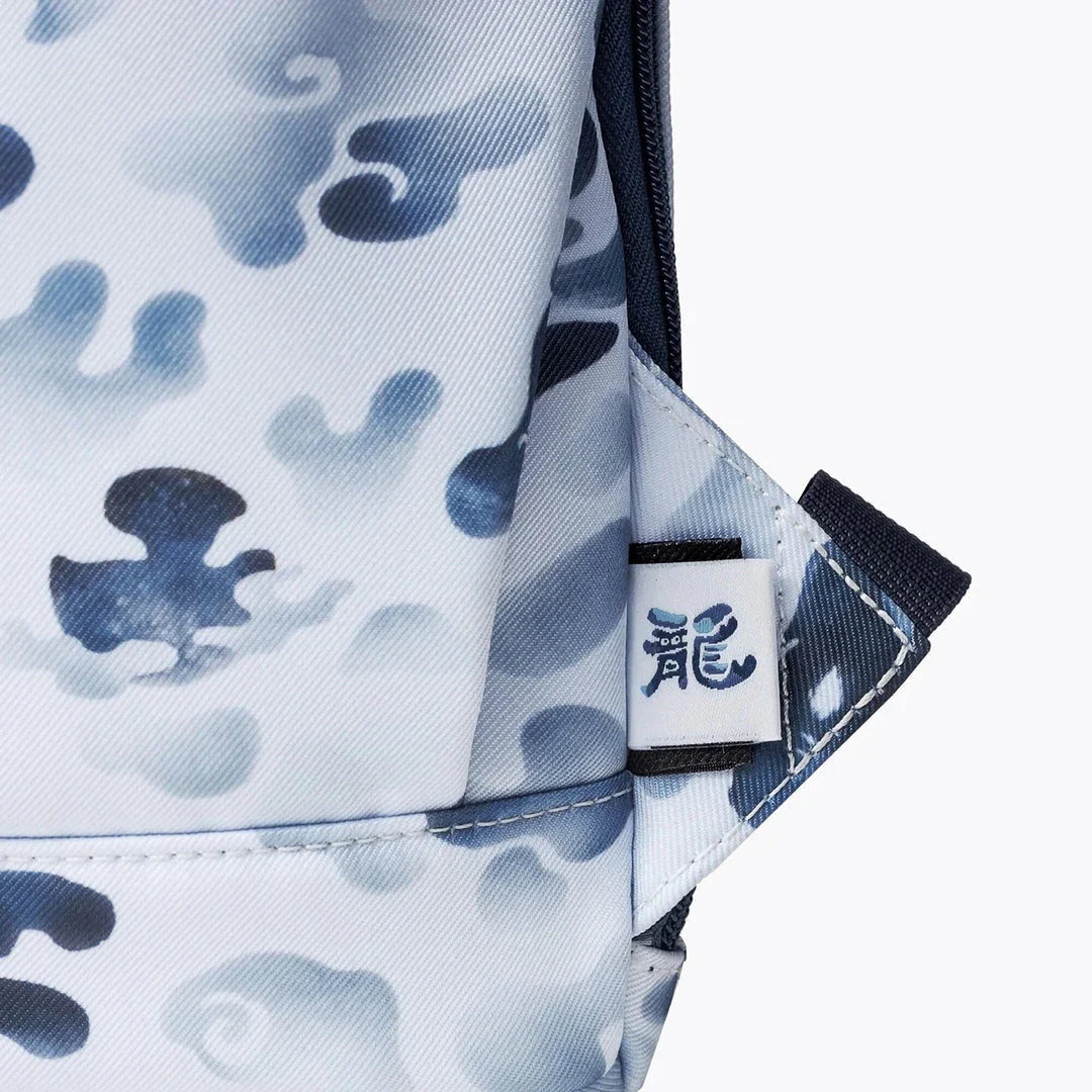 A premium backpack with a stylish dragon camouflage design, featuring a spacious interior, comfortable straps, and secure closures for the modern student.