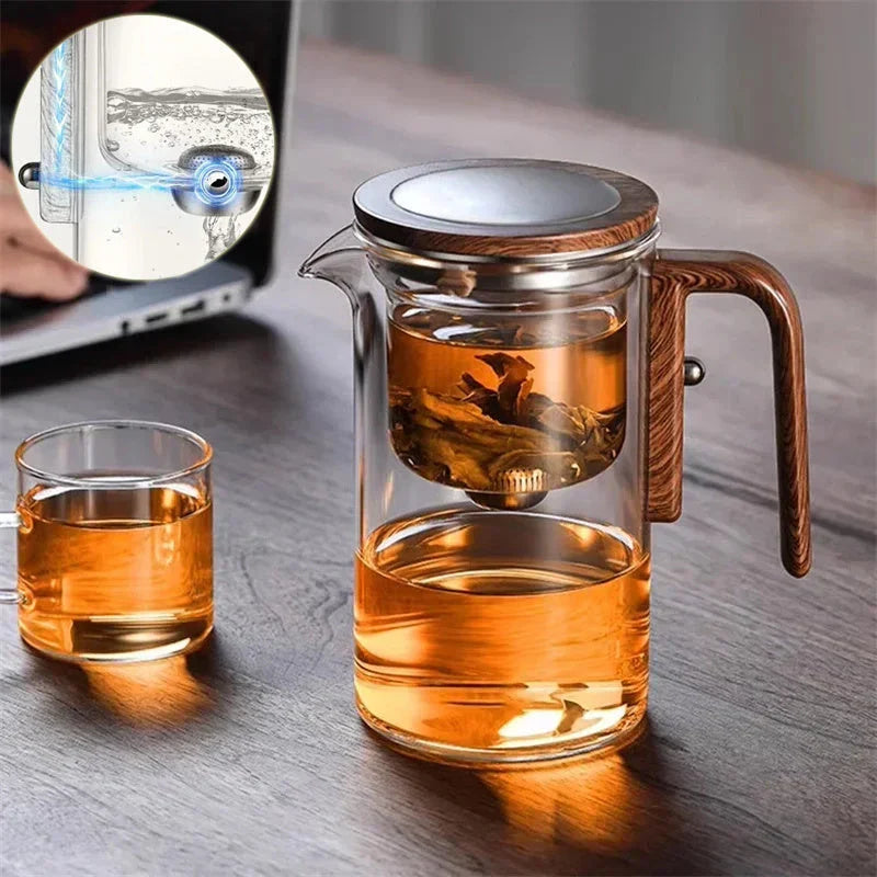 Smart one-button magnetic tea infuser pot with wooden handle, featuring heat-resistant borosilicate glass construction and seamless tea brewing experience.