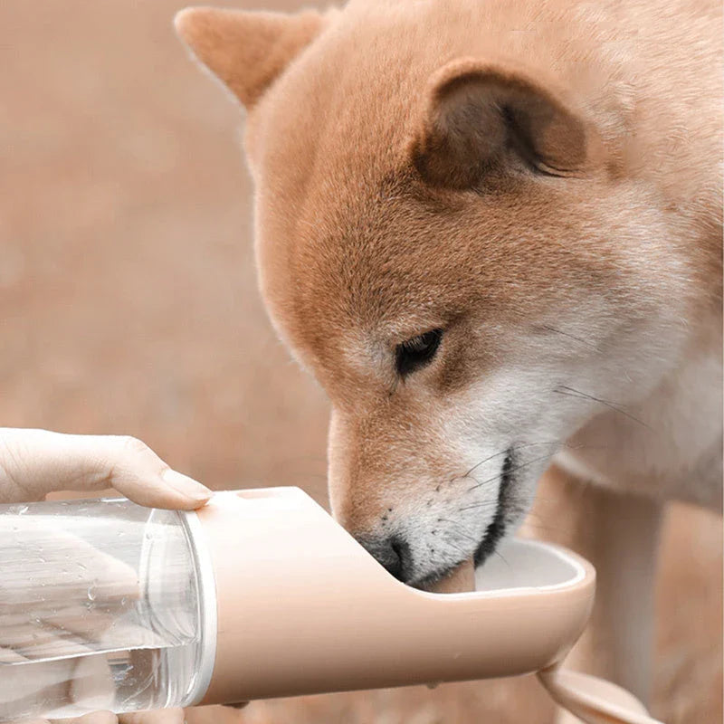 Portable pet water feeder with carbon filter, leak-proof design, and hands-free strap for outdoor hydration