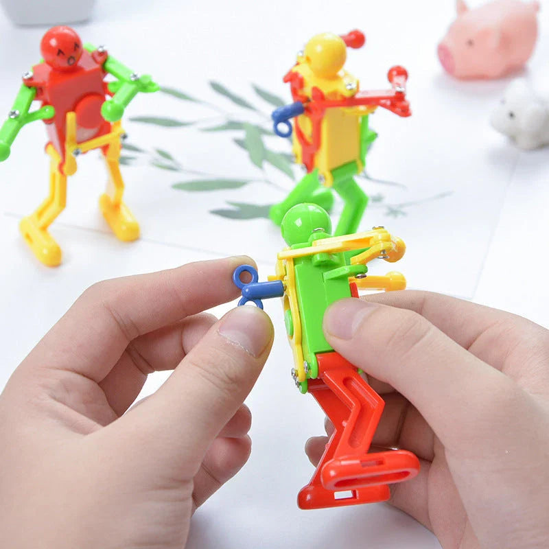 Clockwork wind-up toy robot performing captivating gymnastics display