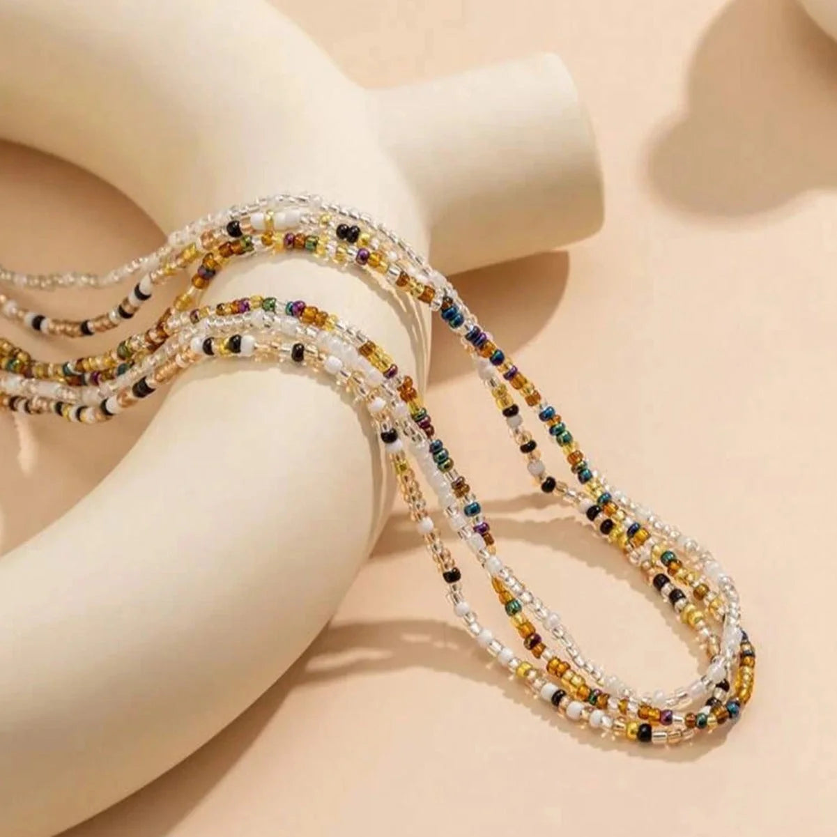 Stylish mixed colour beaded waist chain accessory for beach vacations and holidays