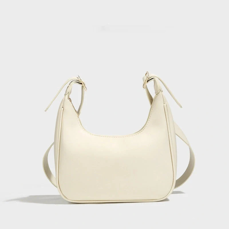 Stylish women's PU leather dumpling crossbody bag in black and white
