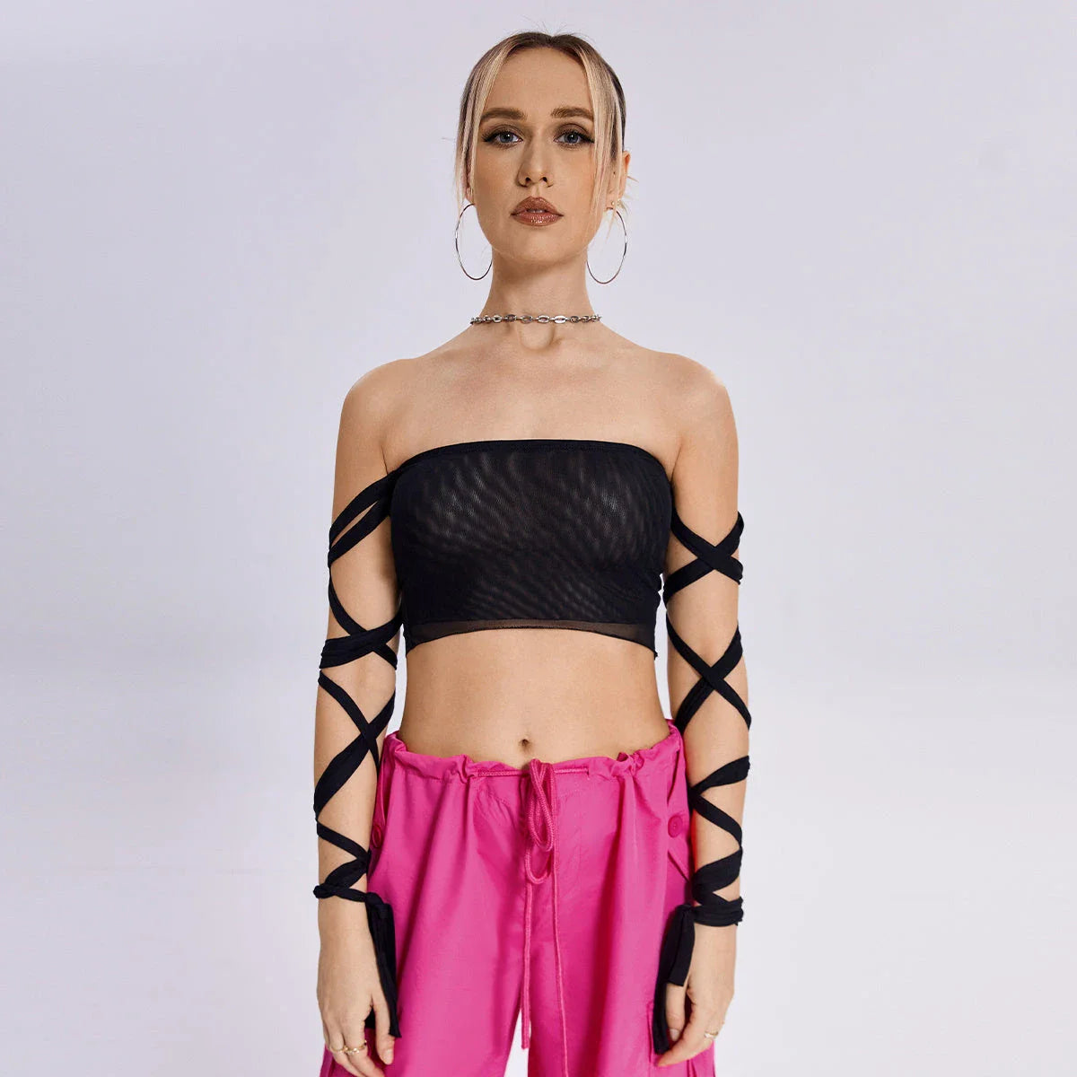 Stylish women's tank top with elastic cross-arm straps, available in black color