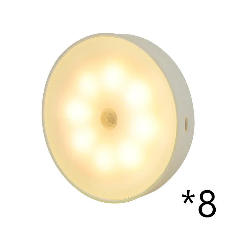 Motion-activated LED puck lights in warm and white color options, with various pack sizes and USB recharging