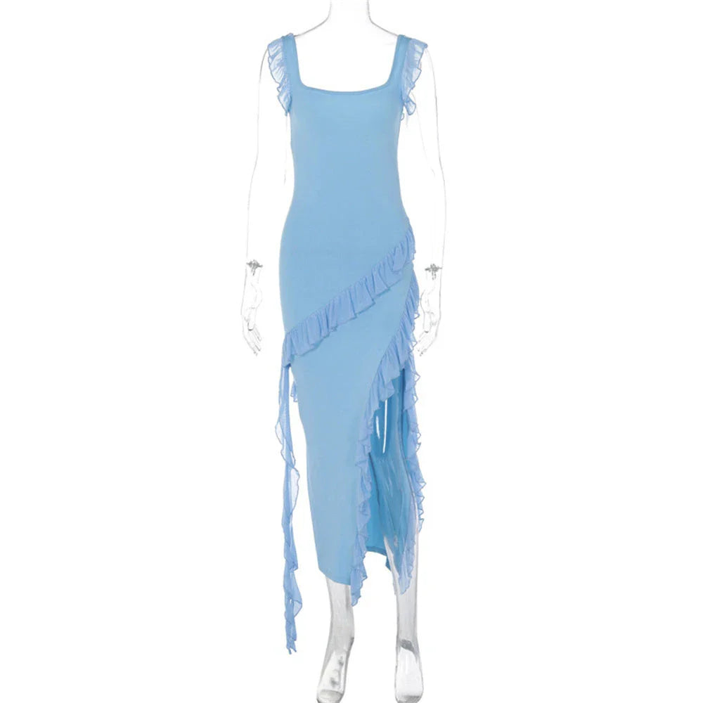 Elegant satin slip dress with ruffle detailing and thigh-high slit, available in various colours and sizes.