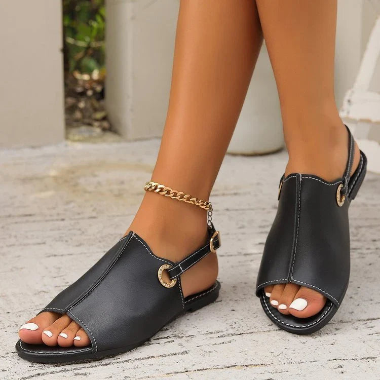 Chic peep-toe sandals with backstrap in black and white colors, ideal for casual summer outings