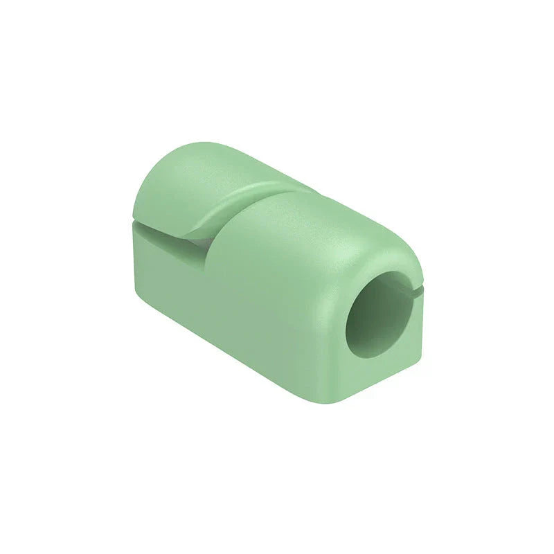 Premium silicone cable clips in various colours for organising and managing cables on desks, entertainment units, and other surfaces