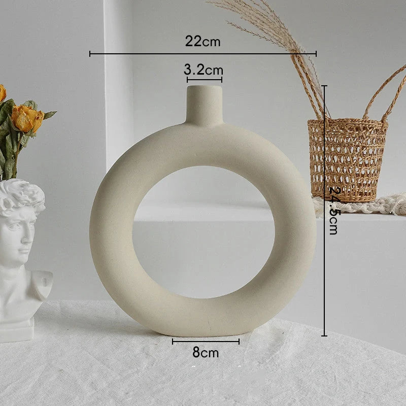 Rustic ceramic vase with matte textured finish for displaying dried flower arrangements in a Scandinavian-inspired home decor setting