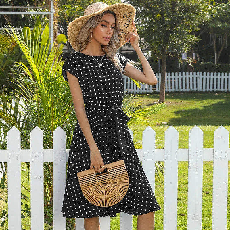 Stylish polka dot midi dress with short sleeves, pleated skirt, and hidden lining for a smooth, non-see-through fit