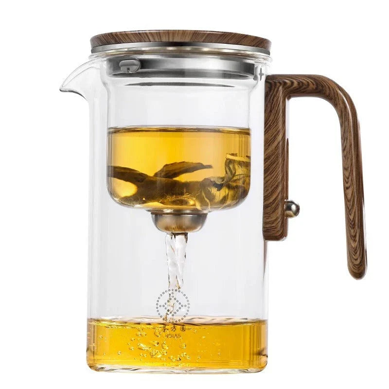 Smart one-button magnetic tea infuser pot with wooden handle, featuring heat-resistant borosilicate glass construction and seamless tea brewing experience.