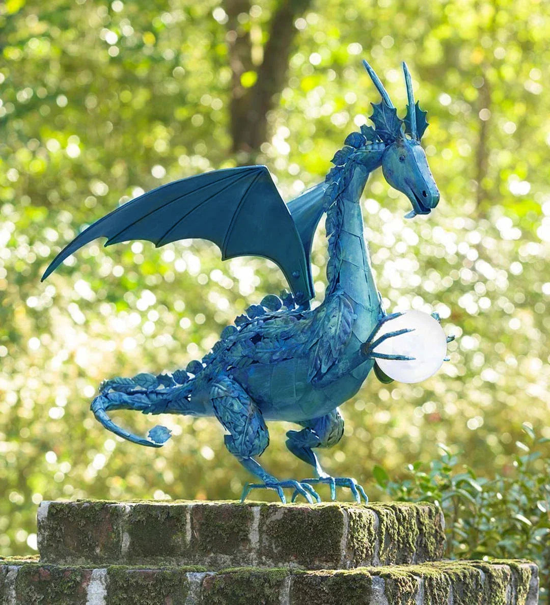 Enchanting green dragon garden statue with serene expression and solar-powered illuminating orb