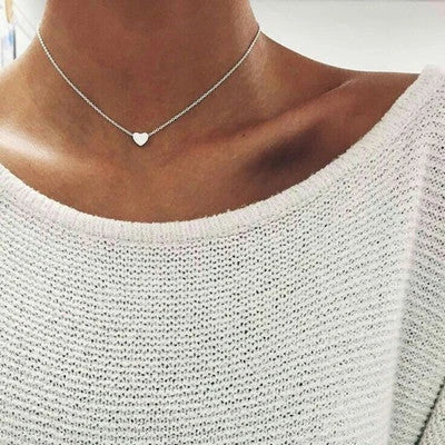 Elegant gold-tone double-sided love pendant necklace with a sleek clavicle chain design
