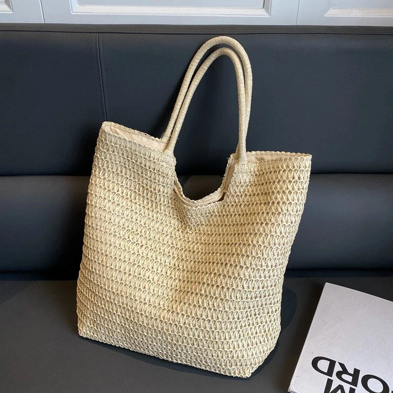 A stylish and spacious straw tote bag in brown and beige colours, perfect for British women on the go.