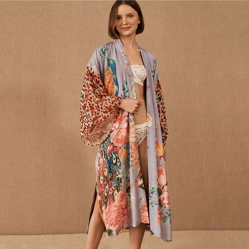 Elegant peacock-printed beach cover-up with lightweight, breathable fabric for stylish sun protection