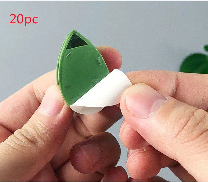 Versatile leaf-shaped plant clips in green, designed to provide discreet and effective support for climbing vines and potted plants