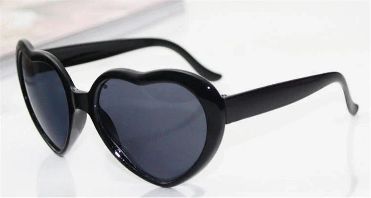 Stylish heart-shaped sunglasses with unique lens design that transforms light into enchanting special effects