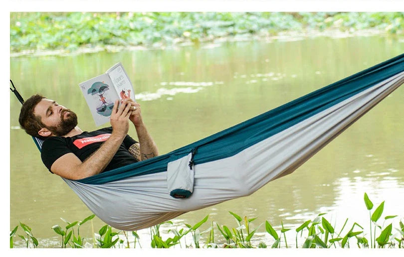 Premium double hammock for outdoor camping and hunting, made with soft, breathable fabric and reinforced climbing ropes