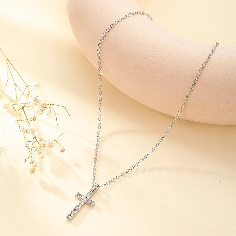 Elegant silver-toned Jesus cross pendant necklace with sparkling artificial gems, showcasing premium British craftsmanship