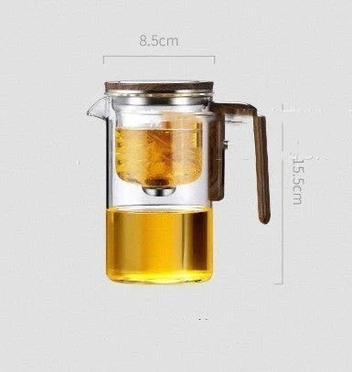 Smart one-button magnetic tea infuser pot with wooden handle, featuring heat-resistant borosilicate glass construction and seamless tea brewing experience.