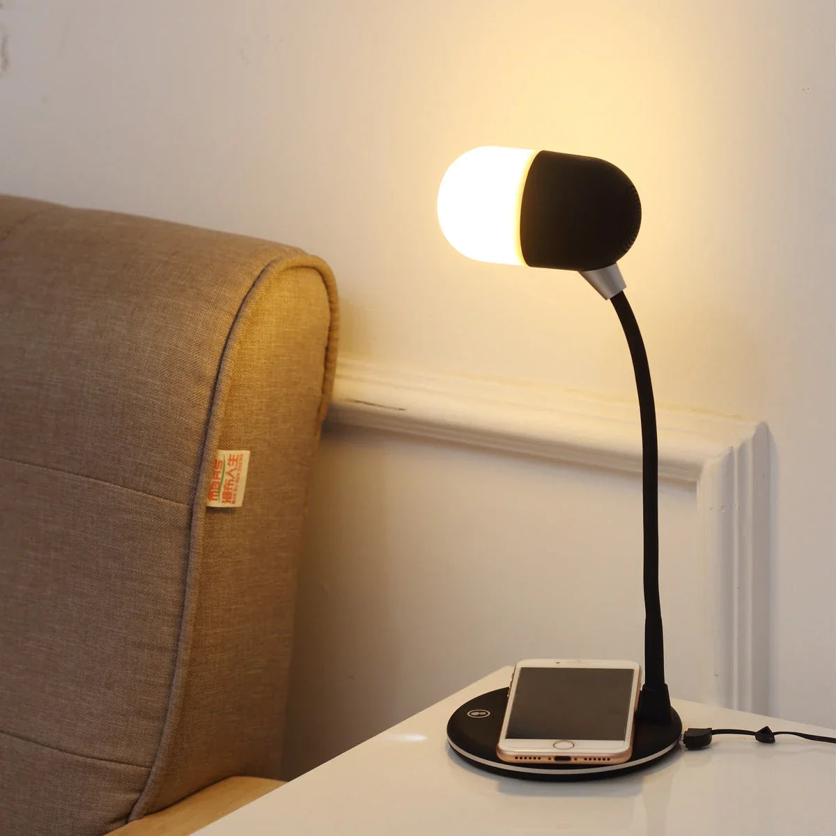 Versatile 3-in-1 desk lamp with wireless charging, Bluetooth speaker, and adjustable brightness controls