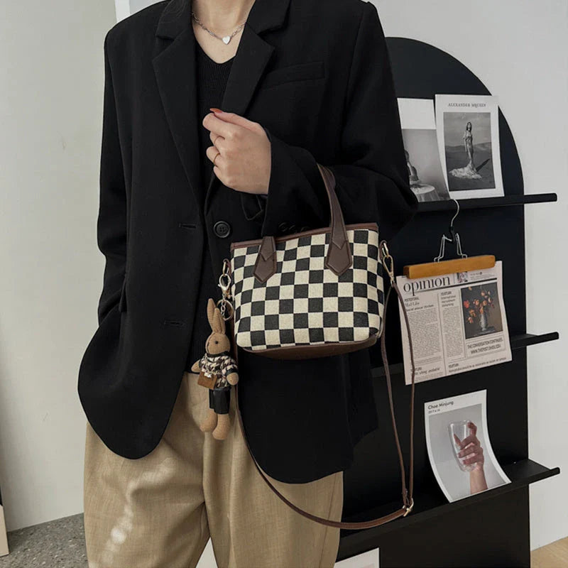 Stylish houndstooth shoulder bags in various colors, including black, coffee, and brown, with and without pendants, featuring a portable and versatile design for everyday use.