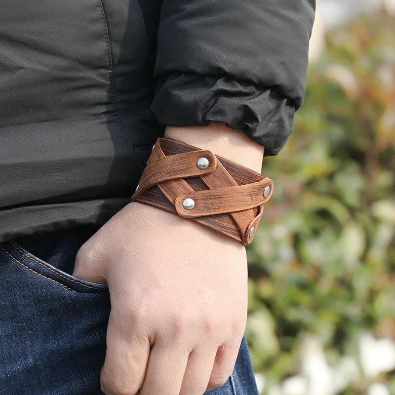 Vintage-inspired brown leather bracelet with geometric shapes and multi-layered design
