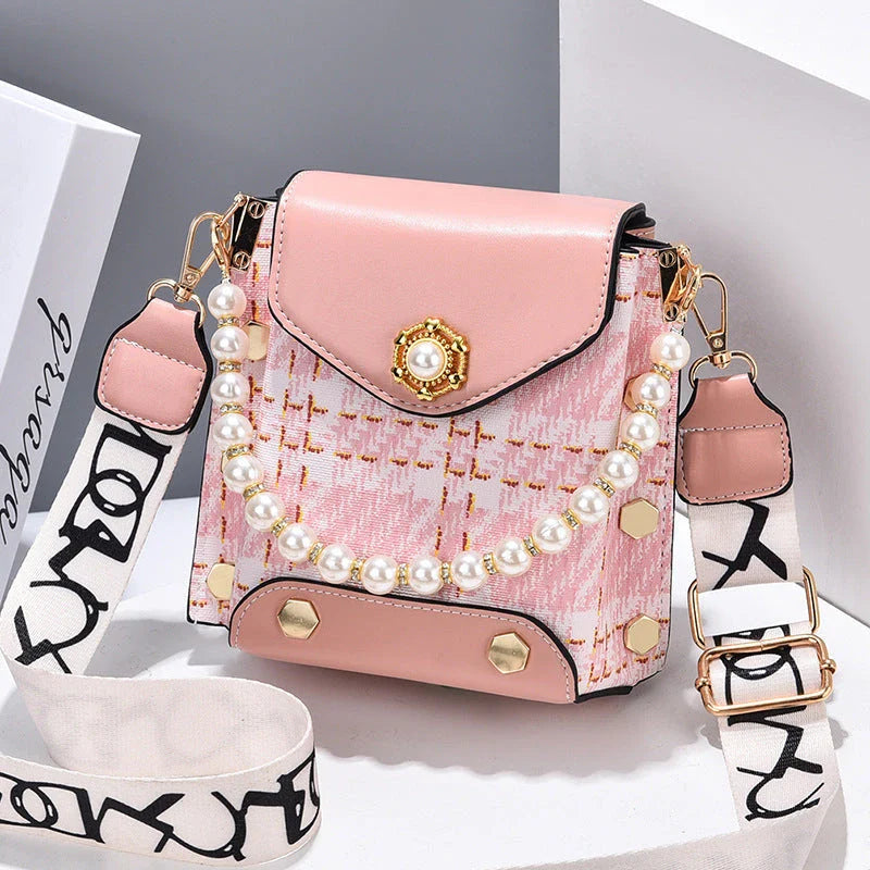 Premium crossbody phone bag with elegant pearl charm, made of durable PU leather and available in multiple color options